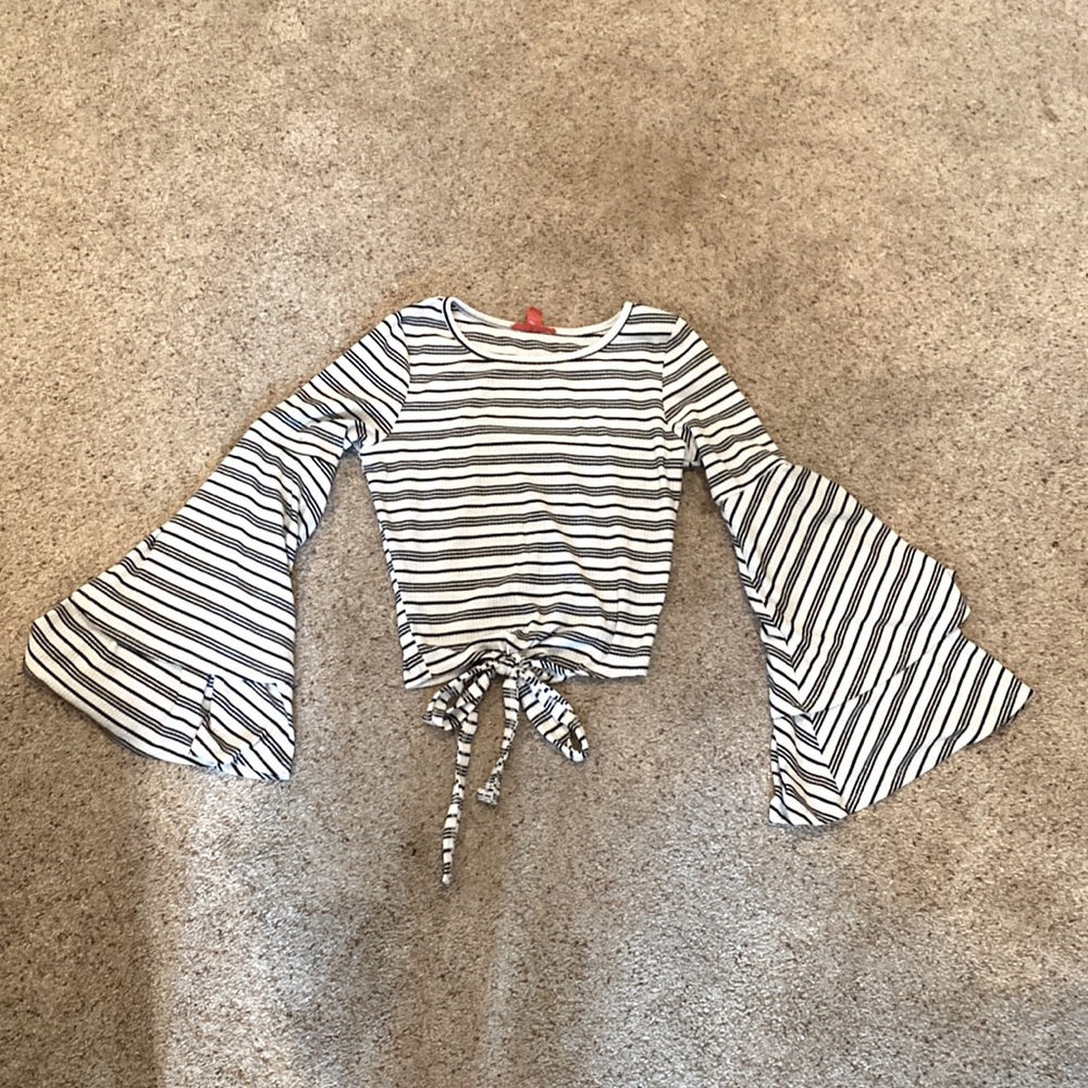 White and black striped flared long sleeve shirt, with bow.